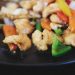 a close up of a plate of food with vegetables